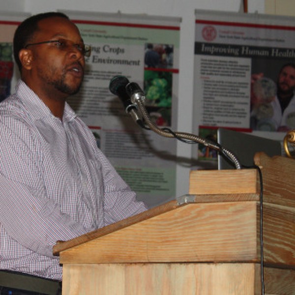 A man stands at a podium and speaks