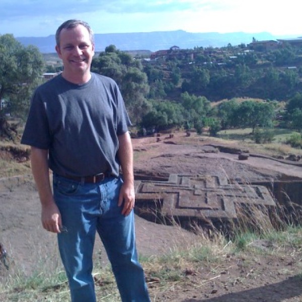 A man stands at a research site in Ethiopia