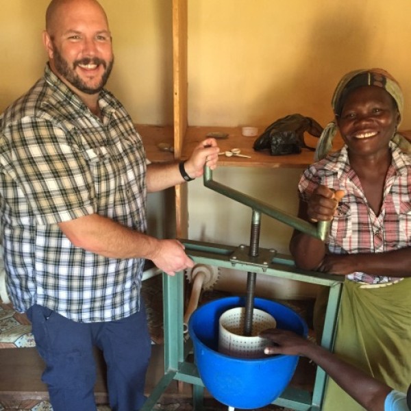 A man and a woman press juice