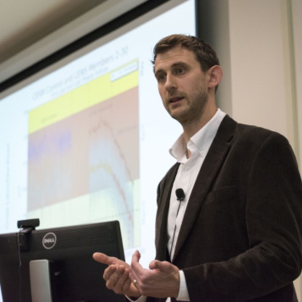 A man presents a lecture at Cornell Reunion Weekend