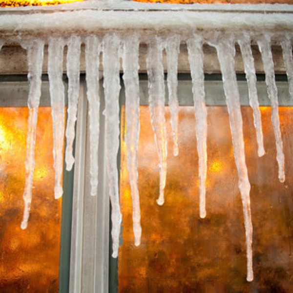 Icicles hang on the side of a building