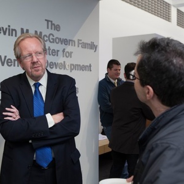 Two men speak together at the Kevin M. McGovern Family Center for Venture Development