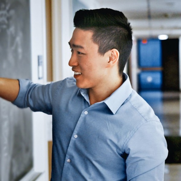 Man draws on chalkboard