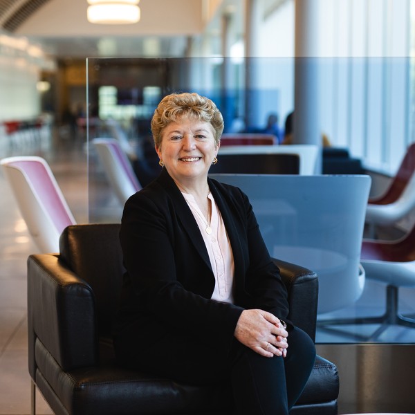 Dean Kathryn J. Boor, Ronald P. Lynch Dean, sits in Stocking Hall's main corridor. 