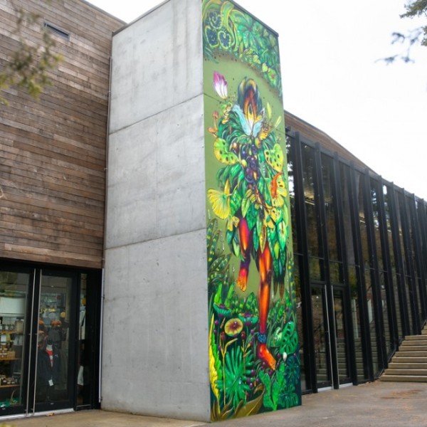 A painted mural is shown on the side of a building