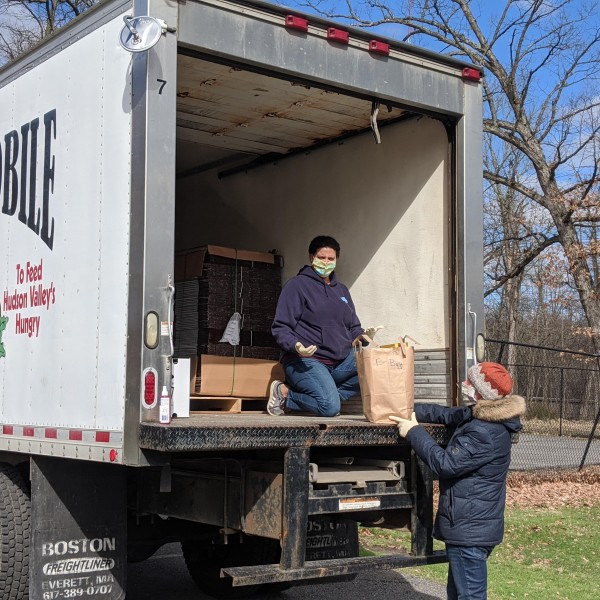 2 people loading Gleanmobile truck