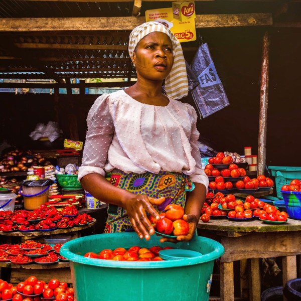 A woman stands in a food stall