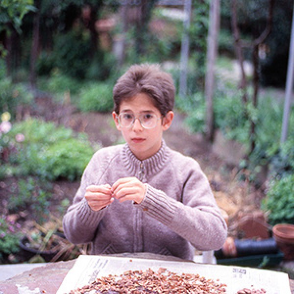 A young boy in a garden. 