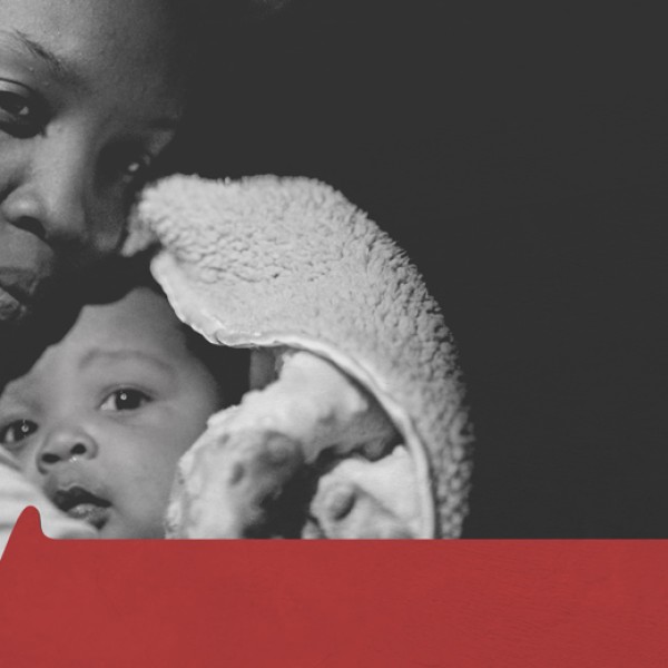 a black mother hugs her child