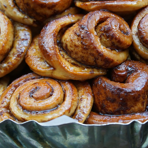 cinnamon buns in a metal tin