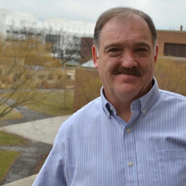 man standing in front of a window