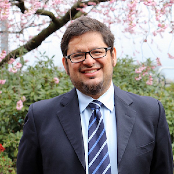 A headshot of Mario Herrero