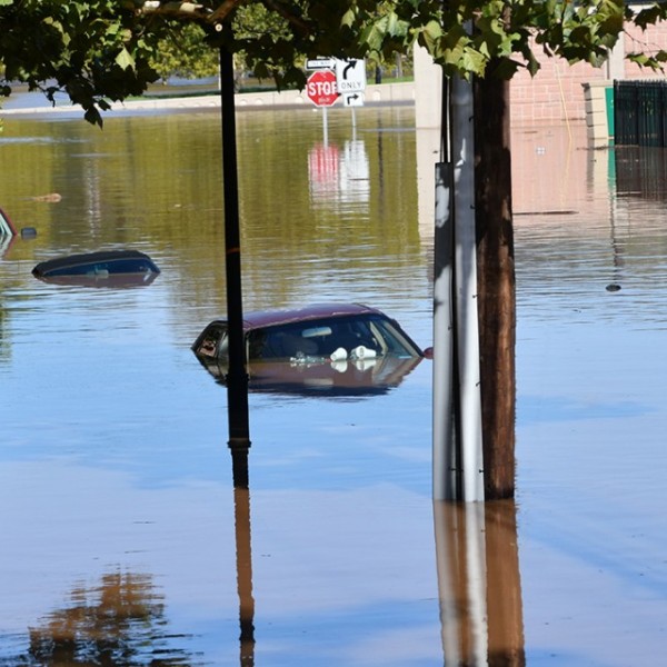Cars submerged in flood waters.