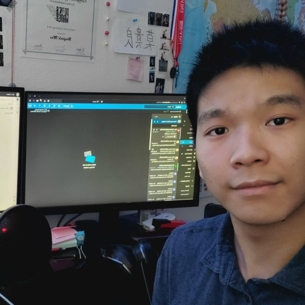 Winfield Mac sitting at a desk with computers