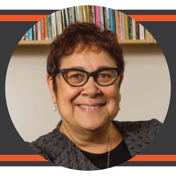 Circular headshot photo of woman with short dark hair and glasses.