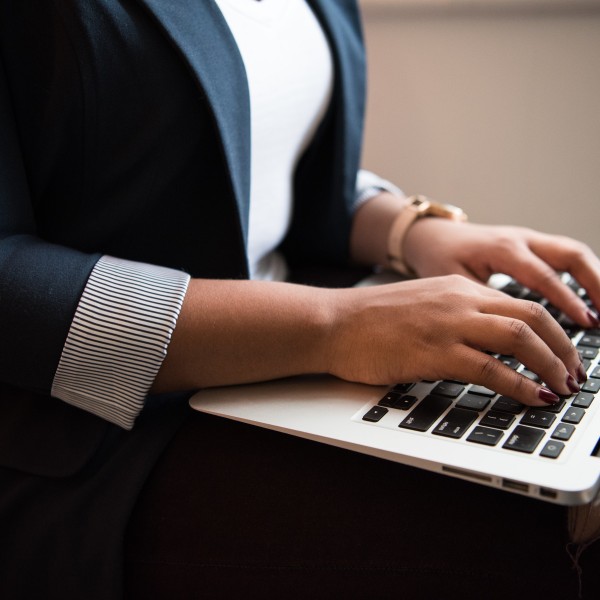 A woman working on a laptop.