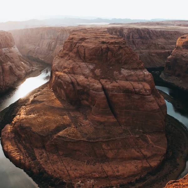The Colorado River curving around a large rock