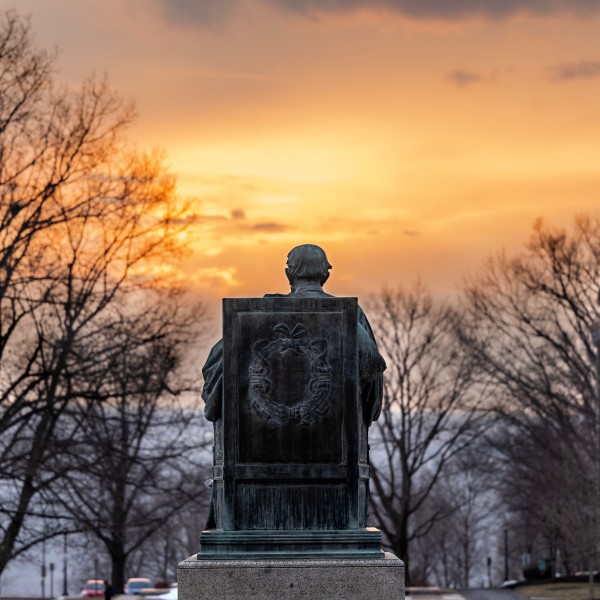 The A.D. White statue from behind at sundown.