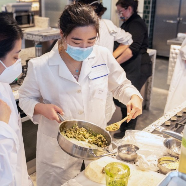 Students prepare a recipe in the Discovery Kitchen