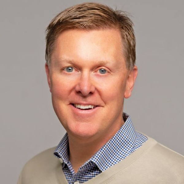Headshot of Tim Barry, a white man with brown hair.