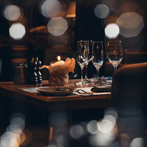image of a set dinner table with a blur