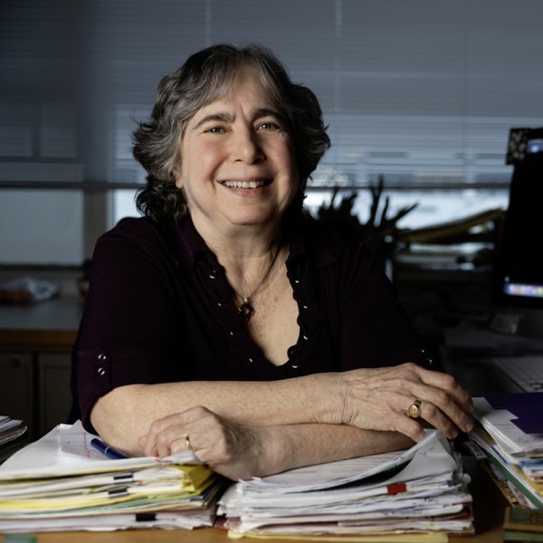 Portrait of Mariana Wolfner at her desk