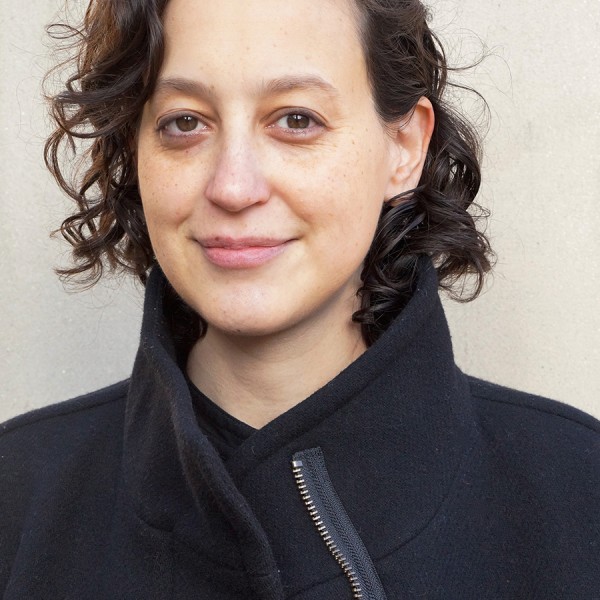 Photo of a person in a black coat