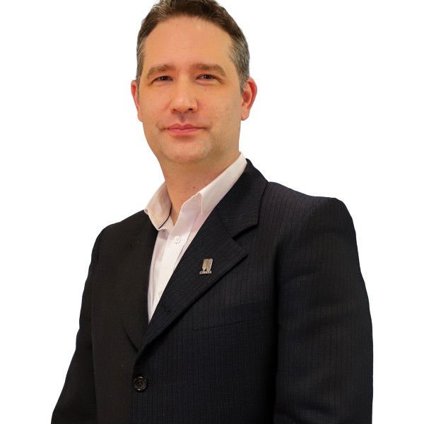 Person wearing a white shirt and suit jacket.