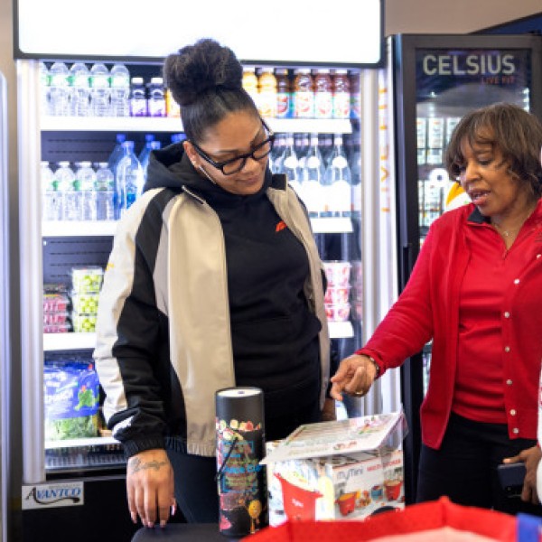 Sheila Bass, program manager of CCE Erie’s Healthy Community Store Initiative, talks about nutrition with Jasmine Robbs , a customer at Buffalo’s Golden Corner store, and Moet Grooms, a CCE educator with the Healthy Community Store Initiative