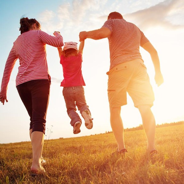 parents holding up their kid