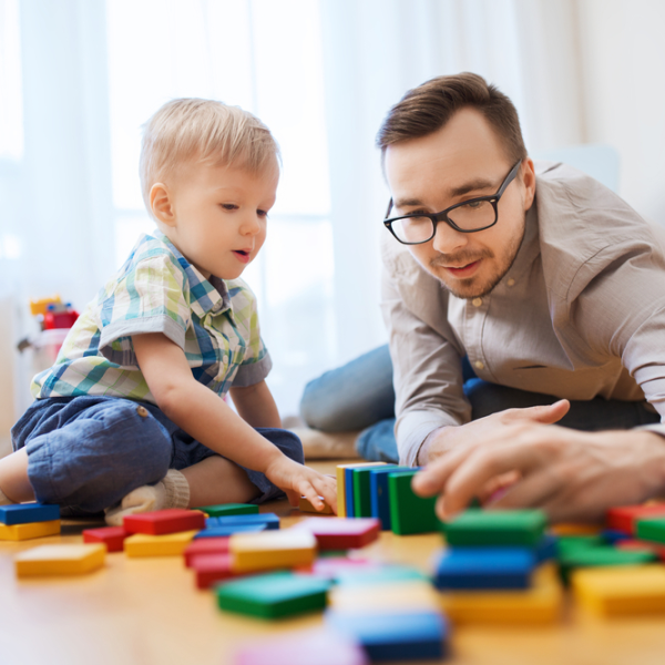 Parent and child playing with bricks