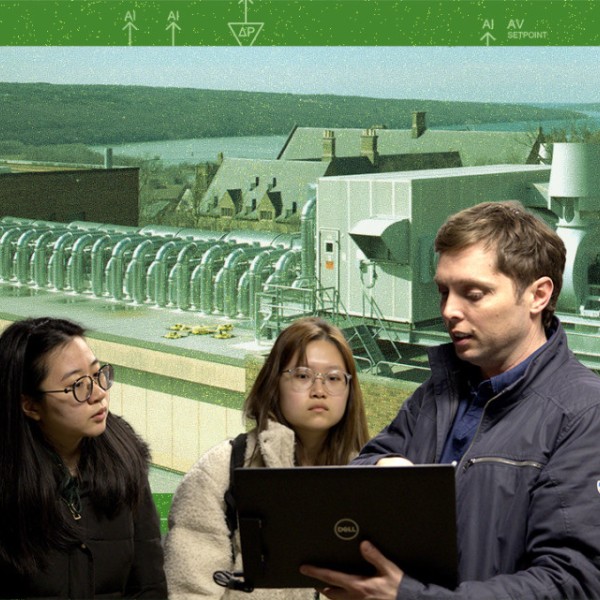 Cornell facilities staff answer questions from students in a tour of Olin Hall's mechanical room.