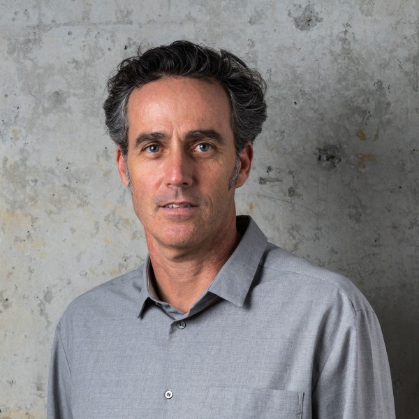 Craig standing in front of concrete wall