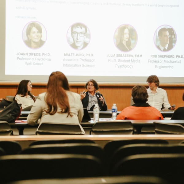 Graduate student Julia Sebastien (left) is pictured with Cornell Professor JoAnn Difede and Cornell Associate Professor Malte Jung at the “Human Psychology, Purpose and Social Life in the Age of AI and Ubiquitous Computing.”