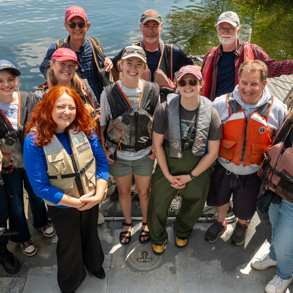 CCE staff, summer interns all wearing lifejackets - like good boaters should.