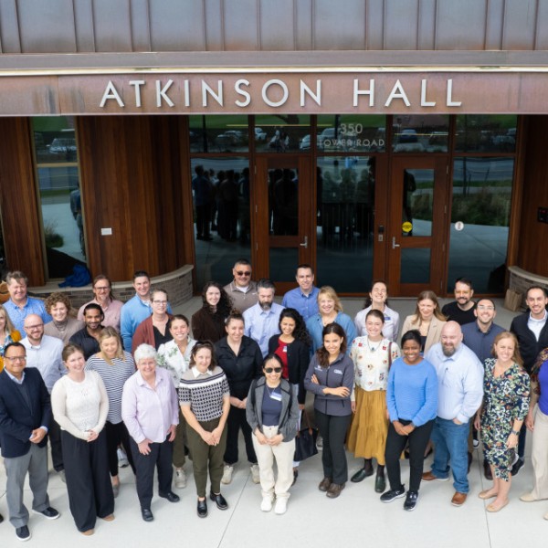 group of people standing outside Atkinson building