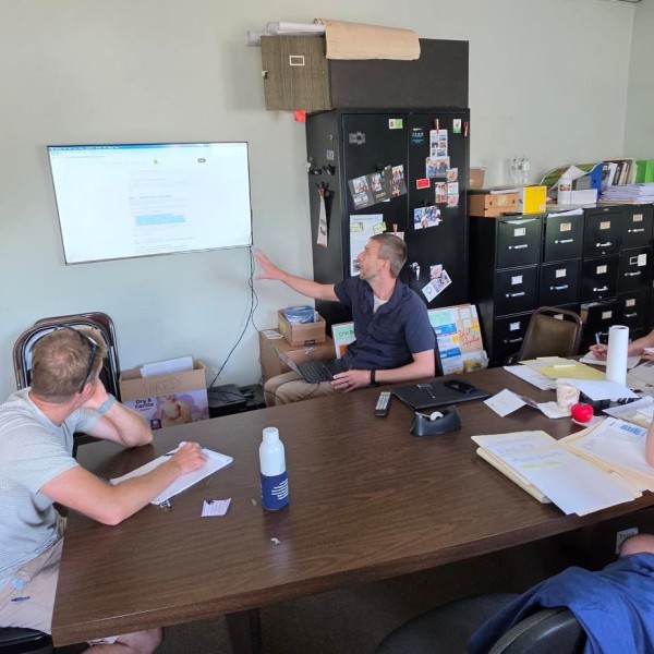 Ph.D. student Nick Gunner shows a group of growers the results of digital ag and ai work.