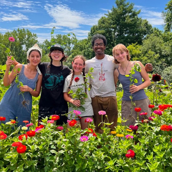 students in a field of flowers