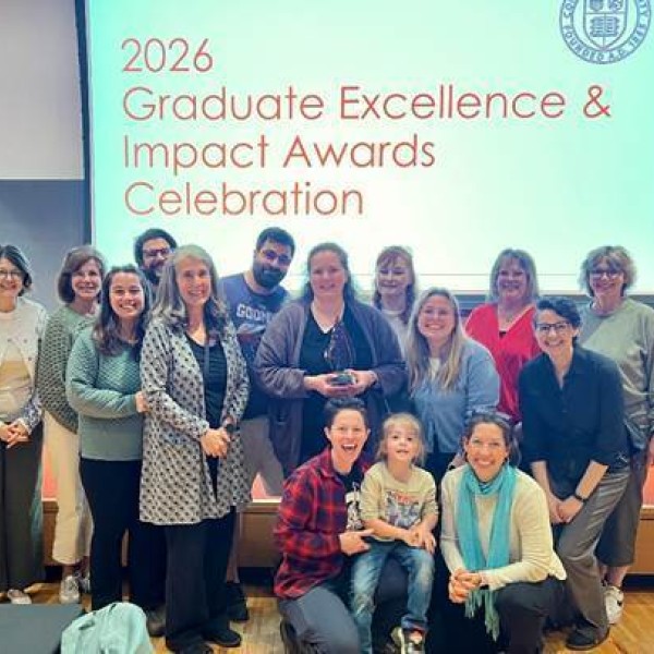 Joanna Alario holding an award at the Graduate Excellence and Impact Awards Celebration 
