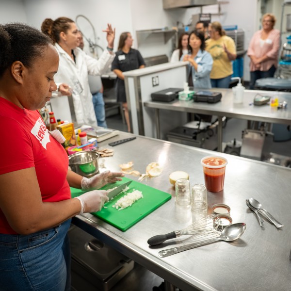 A group of people working in a commercial kitchen