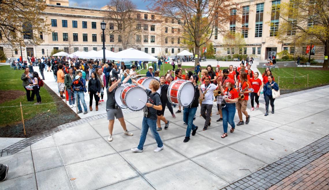 A marching band performs on the Ag Quad