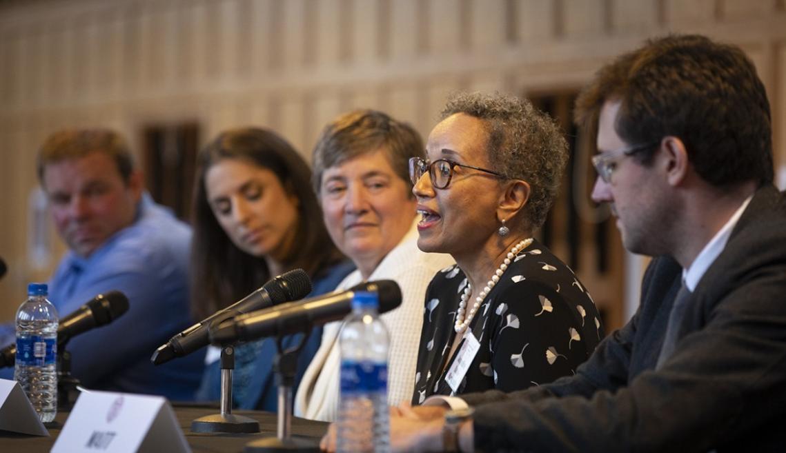 A woman speaks as part of a panel