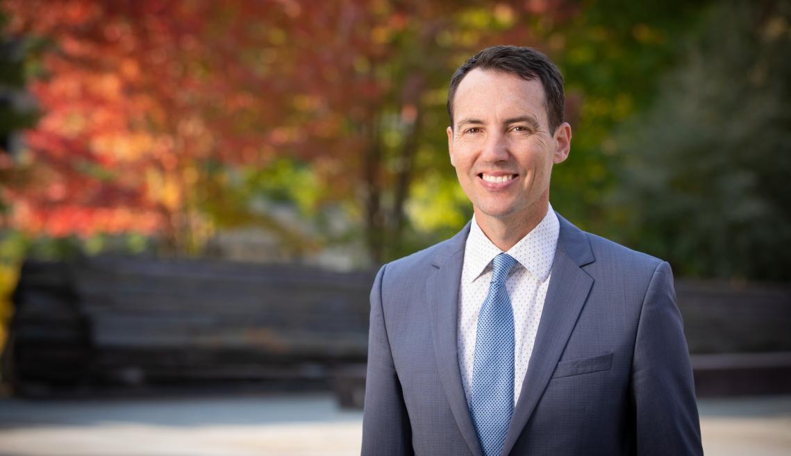 Dean Houlton standing in front of Bailey Hall