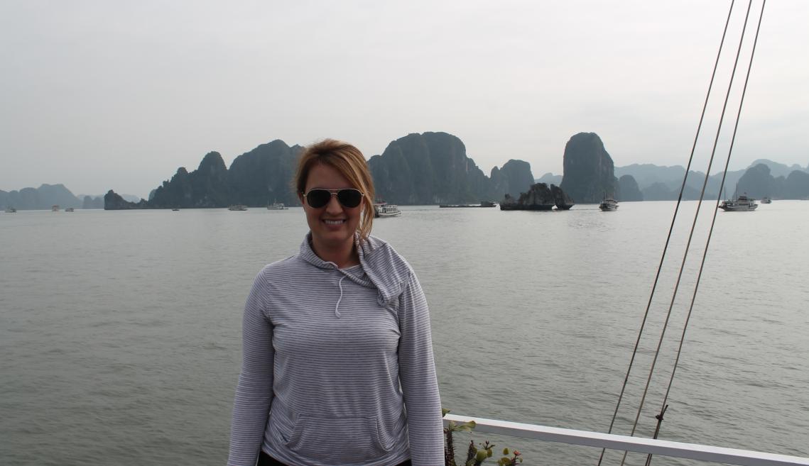 Julie Ficarra stands on a beach