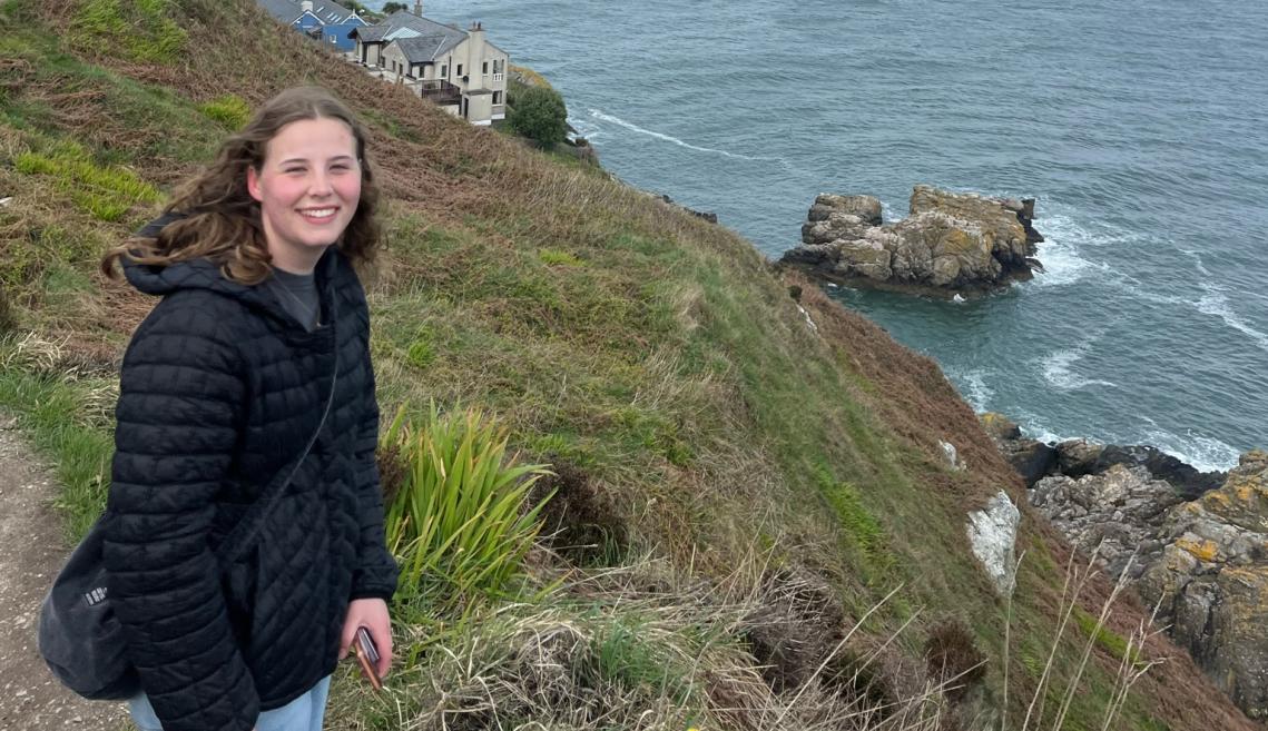 Girl standing in front of water
