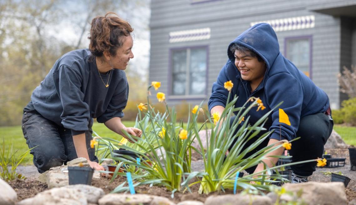 Students in AIISP garden outside Akwe:kon