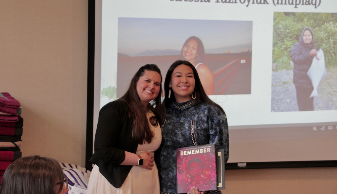 Krissia receives an award.