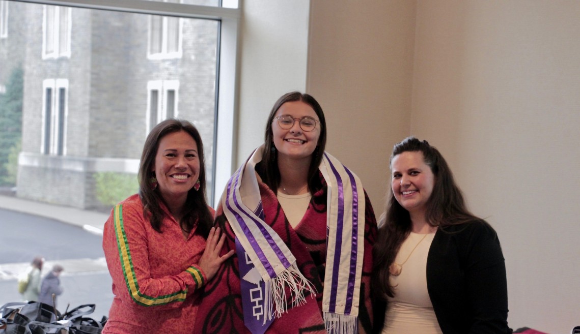 Hawi, MJ, and Sarah smile at the camera.