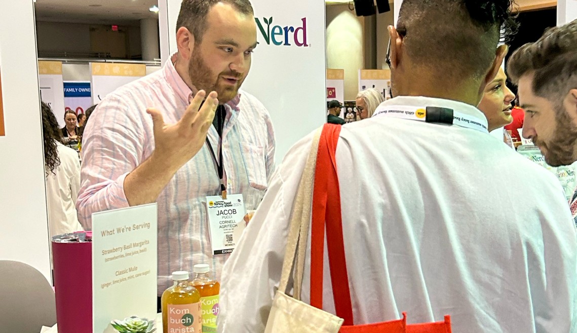 People at a trade show booth