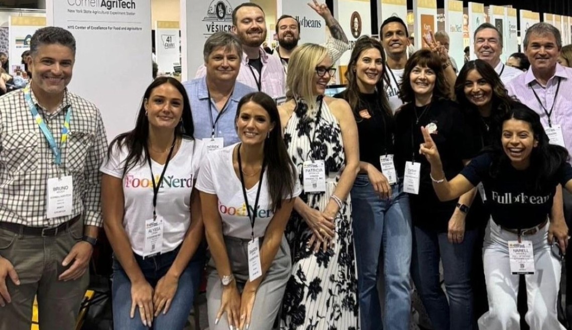 Group photo of people in a trade show hall